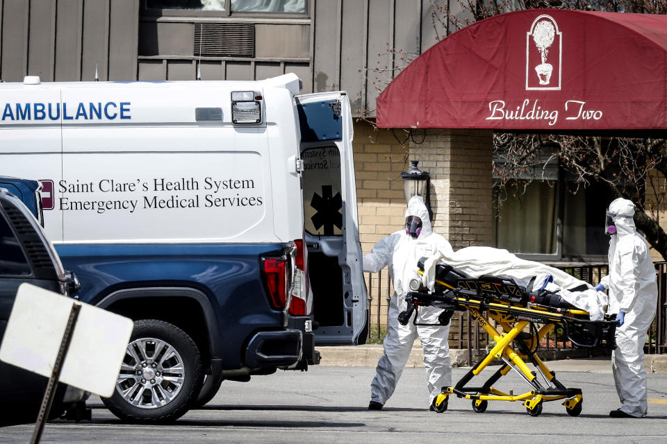 Image: Healthcare officials prepare to load a patient into an ambulance at Andover Subacute and Rehab Center, during the Covid-19 outbreak, in Andover, N.J., on April 16, 2020. (Stefan Jeremiah / Reuters file)