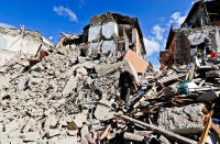 <p>A man walks amid rubbles aftear an earthquake struck in Amatrice Italy, Wednesday, Aug. 24, 2016. (AP Photo/Alessandra Tarantino) </p>