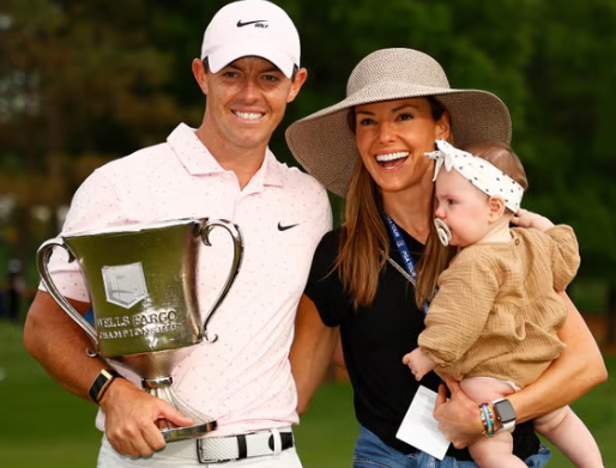 Rory McIlroy celebrates with his wife Erica and daughter Poppy after winning the 2021 Wells Fargo Championship. The golfer filed for divorce earlier this month (ap)
