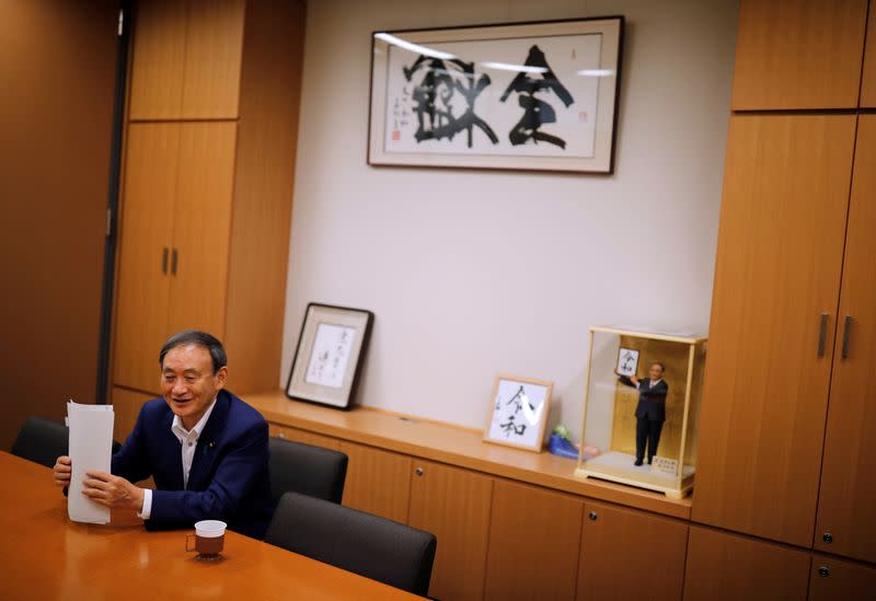 Japan's top government spokesman Chief Cabinet Secretary Yoshihide Suga speaks during an interview with Reuters in Tokyo