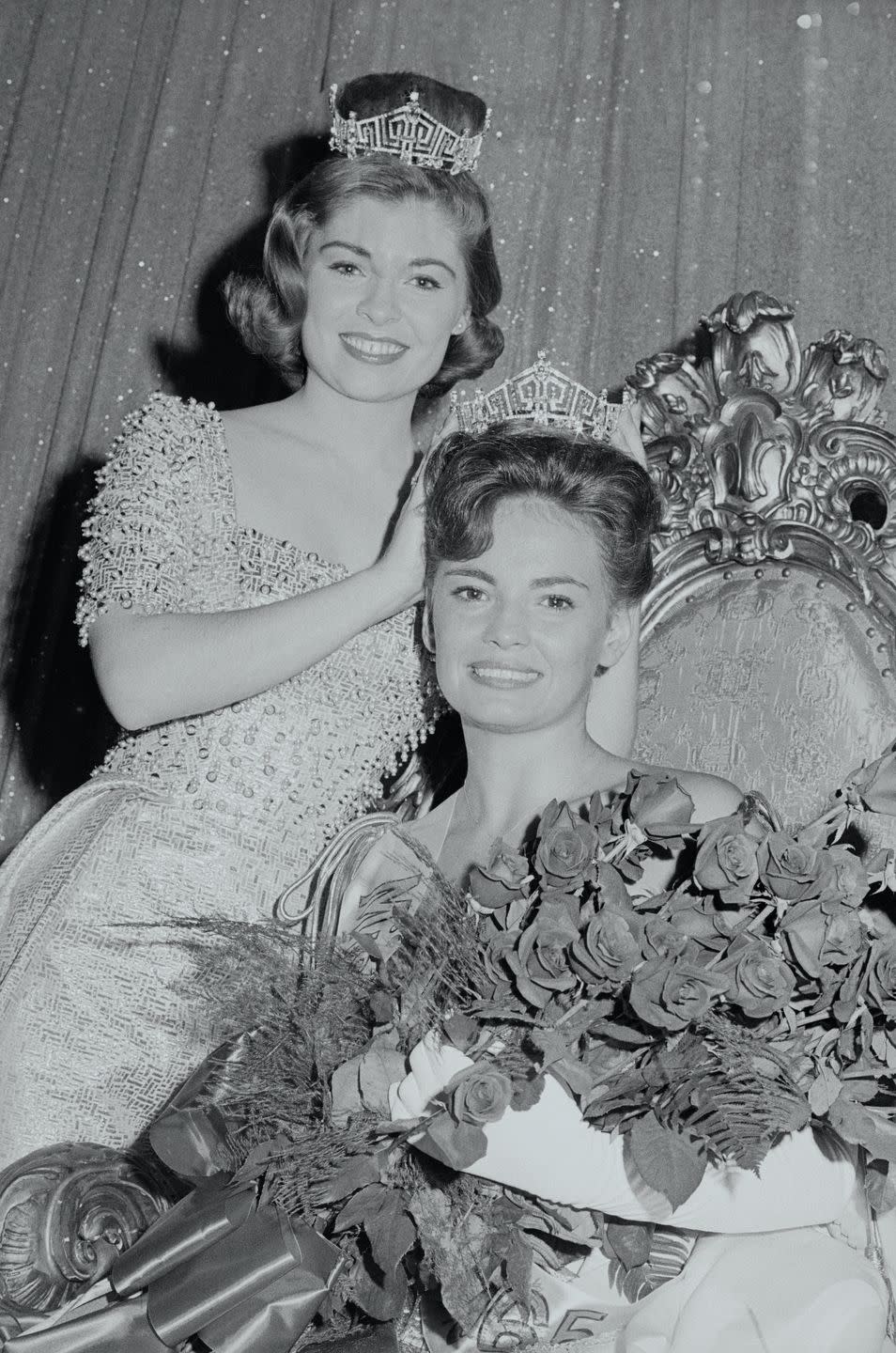 <p>Donna Axum of Arkansas, left, rocks a beaded gown, as she prepares to pass her title on to the following year's winner, Vonda Van Dyke.</p>