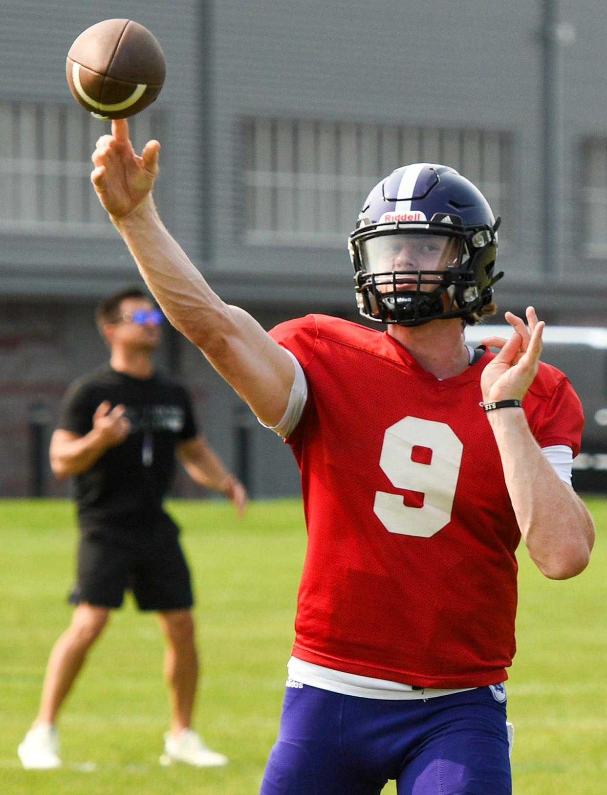 WORCESTER - Holy Cross quarterback Matthew Sluka throws during practice at the school Wednesday, August 9, 2023.