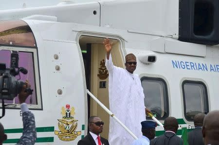 President Muhammadu Buhari arrives at the Margaret Ekpo international airport in Calabar to commission the construction of a new superhihgway in Cross river state, Nigeria, October 20, 2015. REUTERS/Stringer