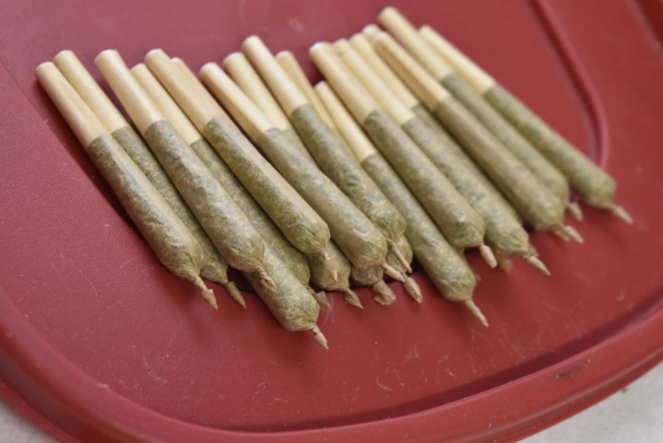 Marijuana cigarettes are seen at the Billings, Mont. medical marijuana dispensary, on Nov. 11, 2020. Recreational marijuana initiatives passed in four states this year, from liberal New Jersey to conservative Montana and South Dakota. The results prove how broadly accepted marijuana has become throughout the country and across party lines. (AP Photo/Matthew Brown)