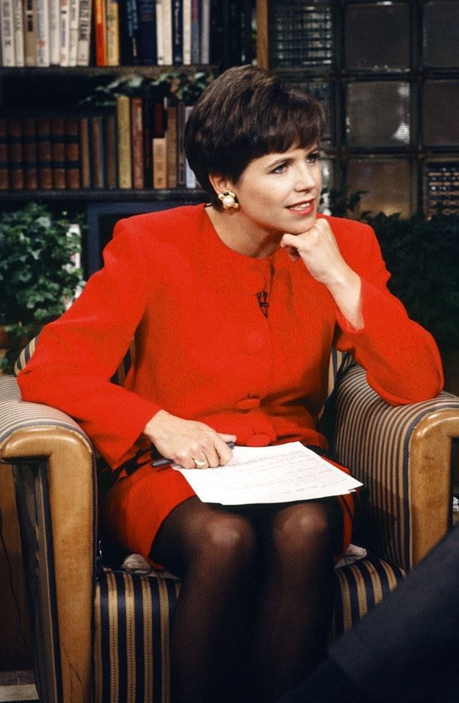 Katie Couric leaning forward as she sits in a chair on the Today Show