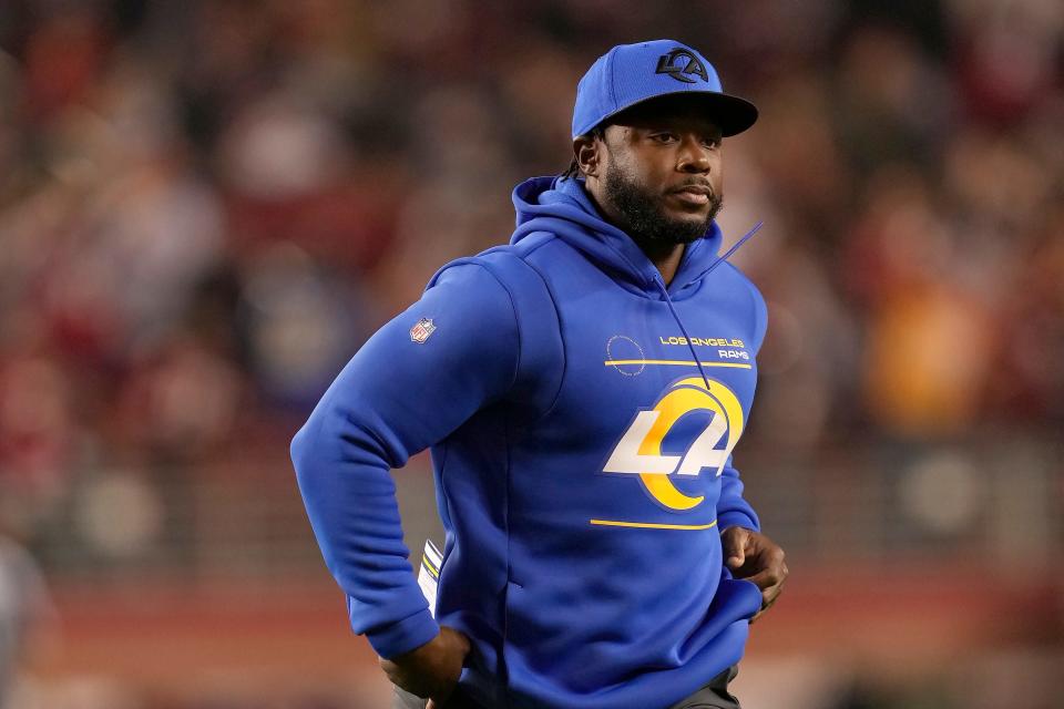 FILE - Los Angeles Rams running backs coach Thomas Brown is shown during an NFL football game against the San Francisco 49ers in Santa Clara, Calif., Monday, Nov. 15, 2021. Brown was a five-star running back destined for the University of Georgia back then in the early 2000s, his mind focused on the Bulldogs and the NFL. He hadn't even imagined trading in his cleats for a whistle -- "I was adamant about not being a coach," he says with a grin.(AP Photo/Tony Avelar, File)