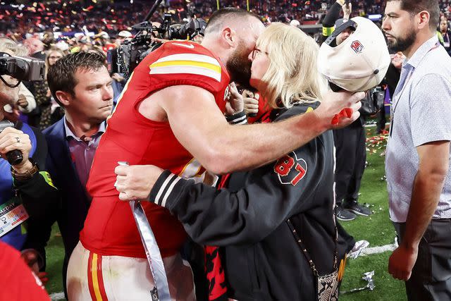 <p>JOHN G MABANGLO/EPA-EFE/Shutterstock </p> Travis Kelce hugs his mom, Donna Kelce, on the field after winning the 2024 Super Bowl in Las Vegas.