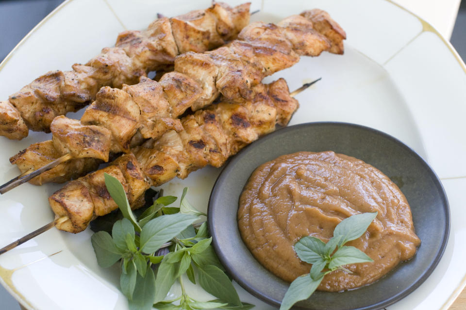 In this Aug. 5, 2013 photo, chicken kebabs with chili banana sauce are shown, in Concord, N.H. (AP Photo/Matthew Mead)