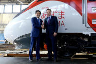 Prime Minister David Cameron (R) and Japanese Prime Minister Shinzo Abe during a tour of the Hitachi North Pole train maintenance Depot in West London, as Abe has warned that Brexit would make the UK "less attractive" to Japanese investors, May 5, 2016. REUTERS/Anthony Devlin/Pool