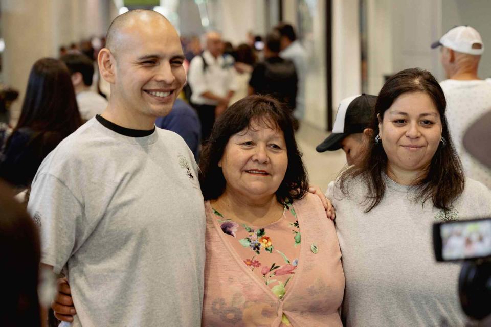 <p>Simon Bucher</p> Brother and sister Sean Ours (L) and Emily Ours Reid (R) reunite with their long-lost biological mother Sara (C) in Chile in February 2024