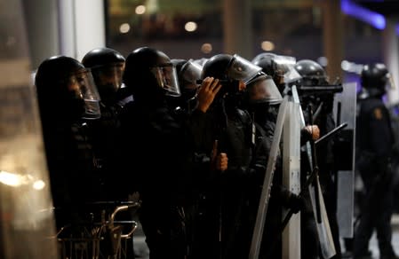 Police officers line up during a demonstration at the airport, after a verdict in a trial over a banned independence referendum, in Barcelona