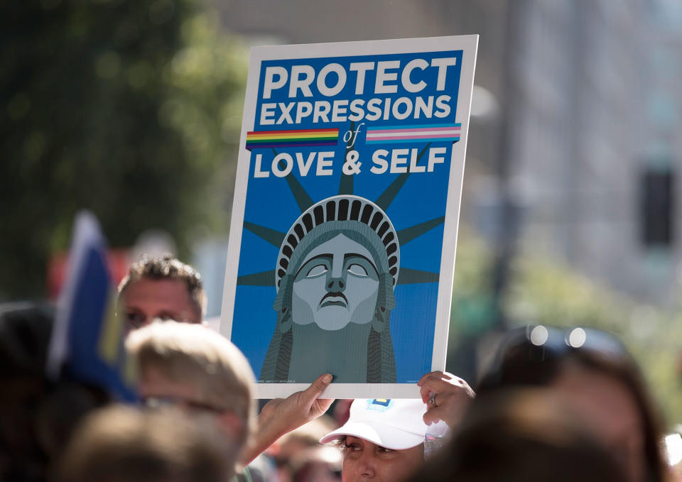 <p>A person holds up a sign that reads ‘Protect Expressions of Love & Self” during the Equality March for Unity and Pride in Washington, Sunday, June 11, 2017. (Photo: Carolyn Kaster/AP) </p>