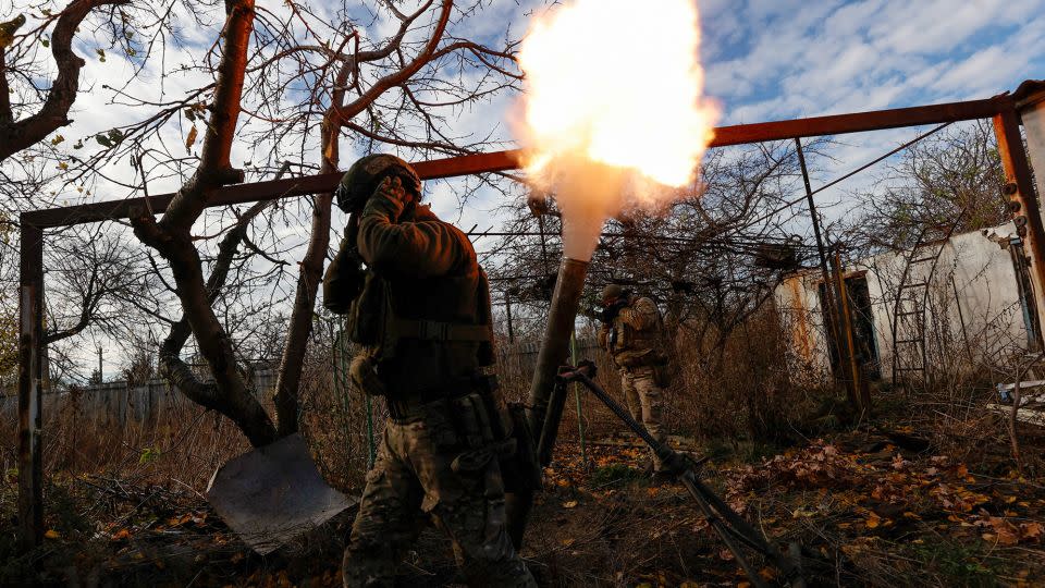 Members of Ukraine's National Guard Omega Special Purpose unit fire a mortar toward Russian troops in the front line town of Avdiivka, amid Russia's attack on Ukraine on November 8, 2023. - Serhii Nuzhnenko/Reuters