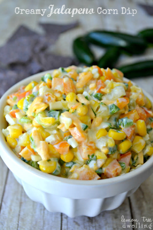 <p>Lemon Tree Dwelling</p><p>Amazing corn dip will please all the guests at your celebration. It's loaded with fresh peppers, onions, cilantro and cheese. <a href="http://www.lemontreedwelling.com/2014/01/jalapeno-corn-dip.html" rel="nofollow noopener" target="_blank" data-ylk="slk:Get the recipe HERE;elm:context_link;itc:0;sec:content-canvas" class="link rapid-noclick-resp">Get the recipe HERE</a>. </p>