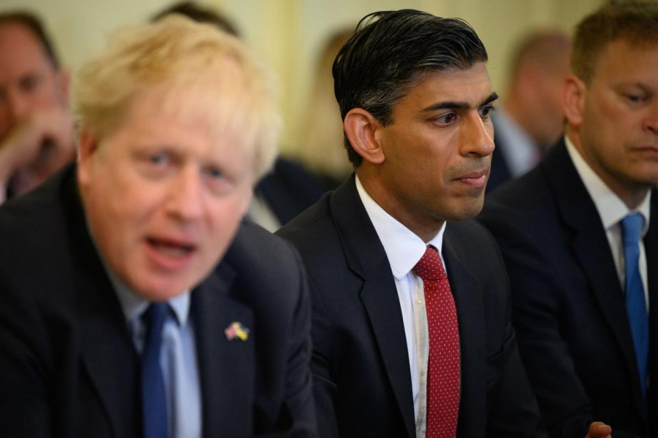 Chancellor Rishi Sunak (centre) and PM Boris Johnson (left)  (PA)