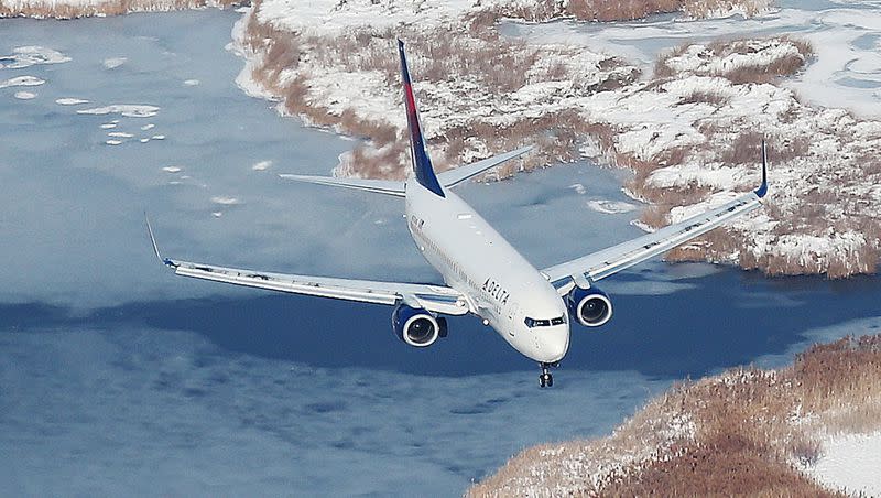 A Delta Airlines jet lands in Salt Lake City International Airport on Dec. 28, 2016.