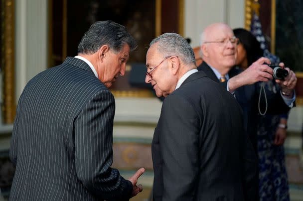 PHOTO: In this March 15, 2022, file photo, Sen. Joe Manchin talks with Senate Majority Leader Chuck Schumer on the White House campus in Washington, D.C. (Patrick Semansky/AP, FILE)