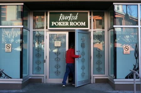 A man enters a poker room at the River Rock Casino in Richmond, British Columbia, Canada December 5, 2017. REUTERS/Ben Nelms