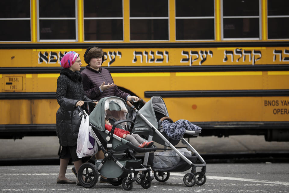 Women pushing strollers walk past the Yeshiva Kehilath Yakov School in the South Williamsburg neighborhood, April 9, 2019 in the Brooklyn borough of New York City. (Photo: Drew Angerer/Getty Images)