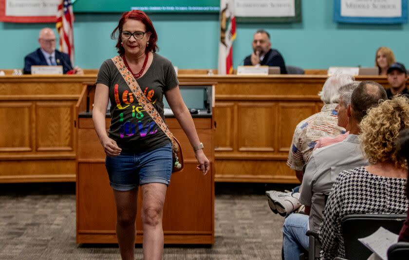 MURRIETA, CA - AUGUST 10, 2023: Parent Tracy Nusbaum, of Murrieta, mother of four children one of which is transgender, leaves the room after speaking out against the parental notification policy during the Murrieta Valley school board meeting on August 10, 2023 in Murrieta, CA. The board voted 3-2 to enact the policy which would notify parents of any transgender children in schools.(Gina Ferazzi / Los Angeles Times)