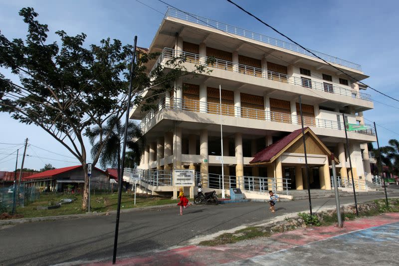 Children play near a Tsunami Escape Building in Banda Aceh