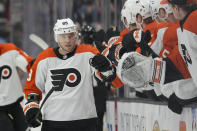 Philadelphia Flyers right wing Cam Atkinson (89) celebrates with teammates after scoring during the first period of an NHL hockey game against the Anaheim Ducks in Anaheim, Calif., Friday, Nov. 10, 2023. (AP Photo/Ashley Landis)