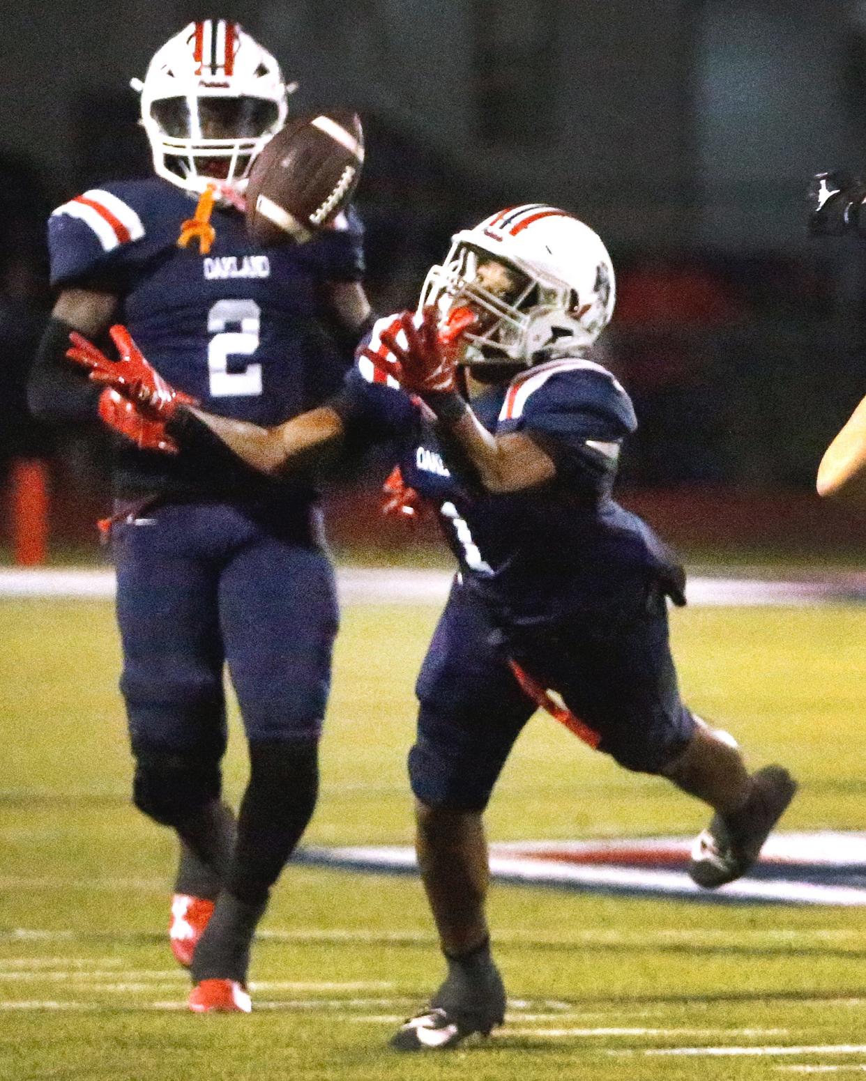 Oakland's Craig Tutt (1) intercepts the ball intended for Riverdale as Oakland's Stephen Ellison (2) looks on during the Battle of the Boro football game at Oakland on Friday, Oct. 27, 2023.