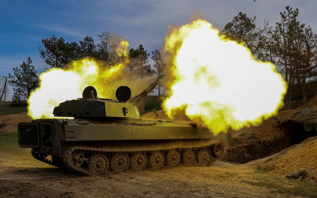 Ukrainian service members of the 37th Marine Brigade fire a 2S1 Gvozdika self-propelled howitzer toward Russian troops, amid Russia's attack on Ukraine, in a front line in Southern Ukraine, March 30, 2024.