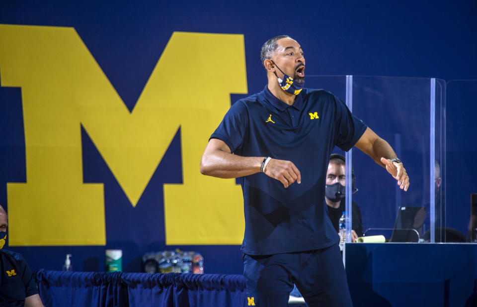 Michigan head coach Juwan Howard shouts to his players from courtside in the first half of an NCAA college basketball game against Northwestern at Crisler Center in Ann Arbor, Mich., Sunday, Jan. 3, 2021. (AP Photo/Tony Ding)