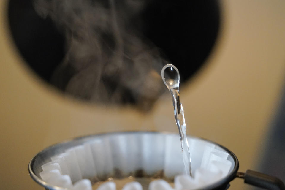 Dripped coffee is prepared at Vigilante Coffee, Wednesday, Sept. 1, 2021, in College Park, Md. A confluence of supply chain problems, drought, frost and inflation all point to the price of your cup of morning coffee going up. The tricky part is trying to figure when — and how much. A sustained drought followed by two July frosts blew a hole in Brazil's coffee output, sending futures contract prices for the popular Arabica bean to near seven-year highs. (AP Photo/Julio Cortez)