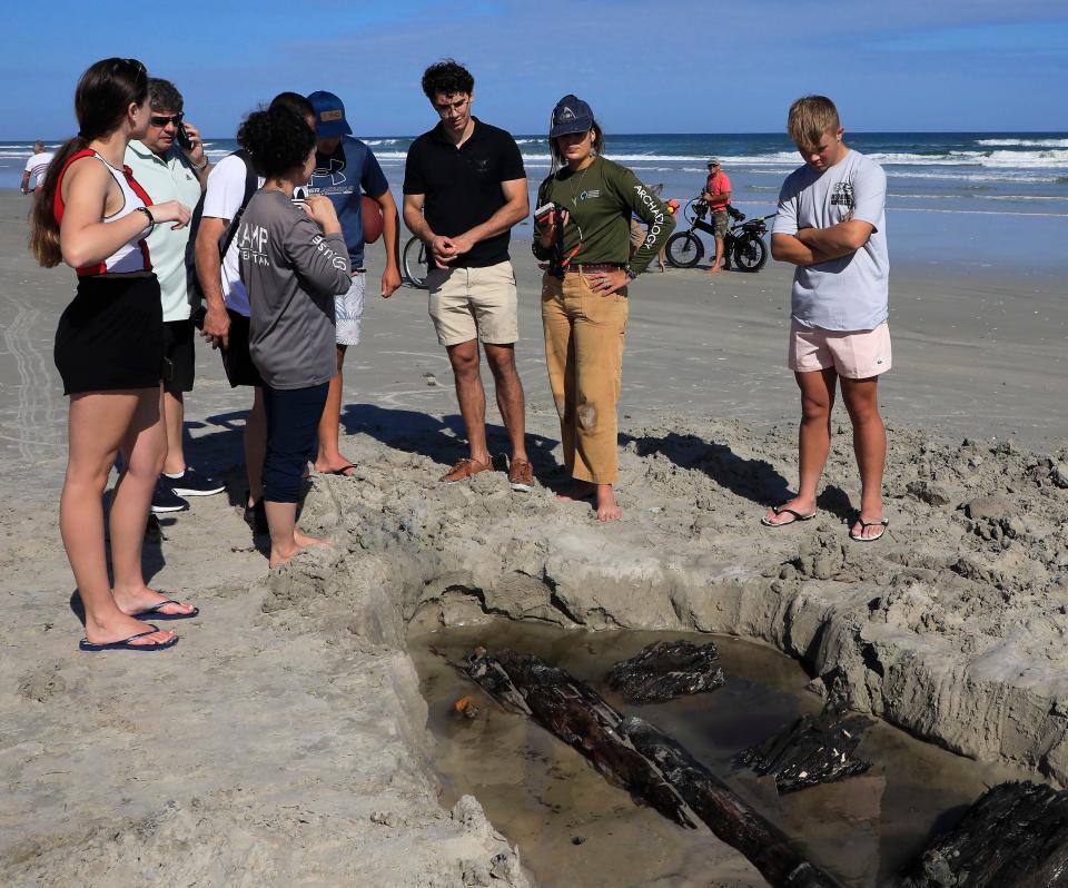 Bystanders ask archaeologist crew members from St. Augustine Lighthouse u0026 Maritime Museum's research program questions regarding what is believed to be an 1800s' shipwreck on Daytona Beach Shores Tuesday, Dec. 6, 2022.