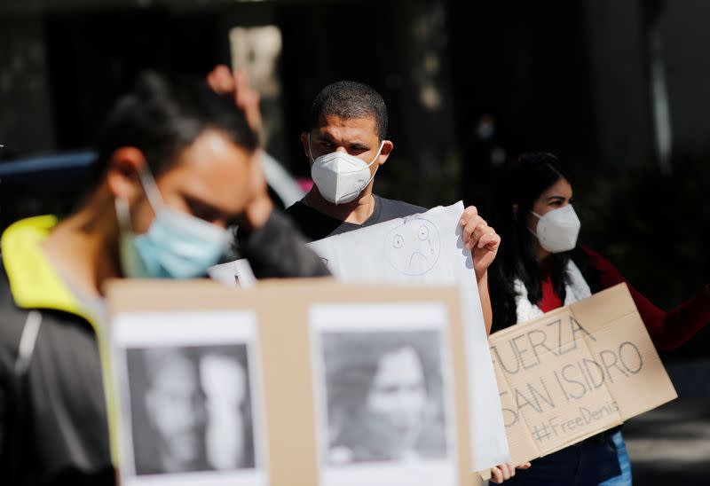 Cuban students living in Mexico and other demonstrators protest outside the Cuban Embassy in Mexico City