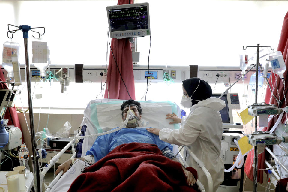 A nurse tends to a patient affected by COVID-19 at the Shohadaye Tajrish Hospital in Tehran, Iran, Saturday, April 17, 2021. After facing criticism for downplaying the virus last year, authorities have put partial lockdowns and other measures in place to try and slow the coronavirus’ spread, as Iran faces what looks like its worst wave of the coronavirus pandemic yet. (AP Photo/Ebrahim Noroozi)