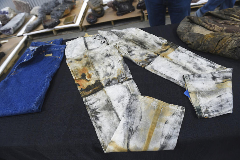 old jeans with damage on a table