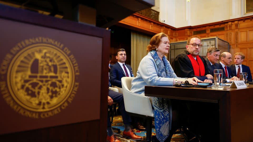 Tania von Uslar-Gleichen (second from left), Germany's legal adviser, and Christian J. Tams (center), a member of the German delegation, attend the ICJ on Tuesday. - Piroschka Van De Wouw/Reuters