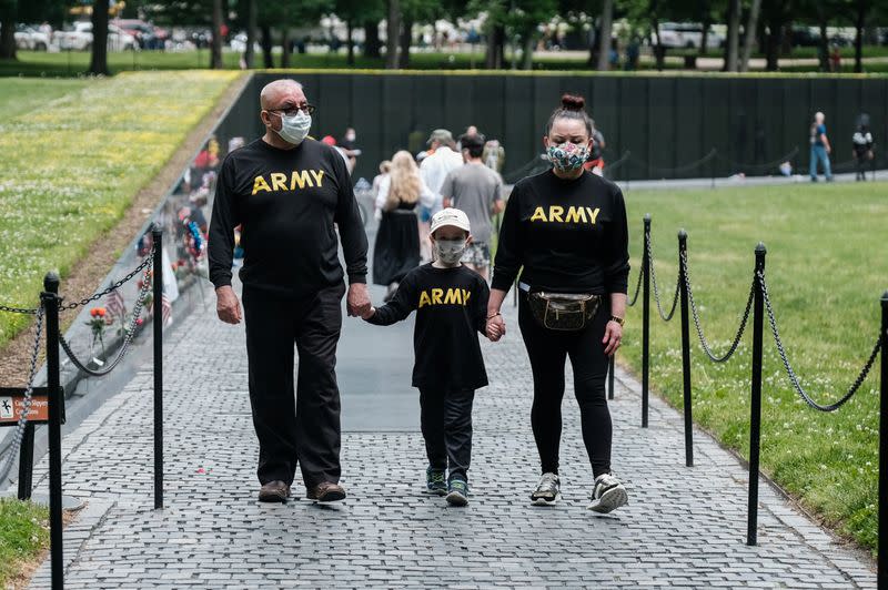 Veterans and members of the public visit the Vietnam Veterans Memorial while commemorating the U.S. Memorial Day holiday in Washington