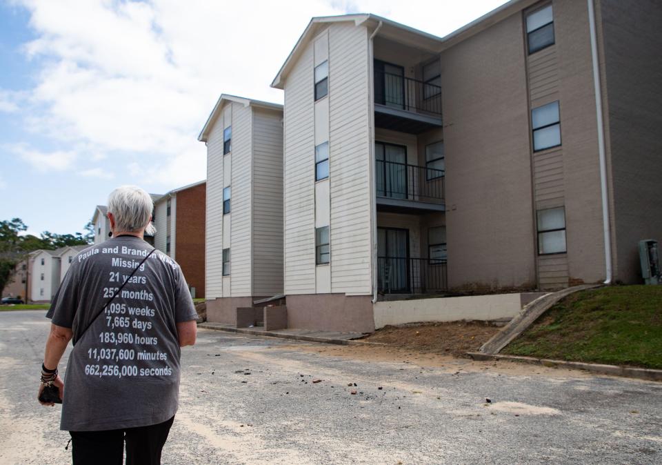 On the 21-year anniversary of her younger sister’s disappearance, Mary Ramsbottom visits the Valdosta apartment complex her sister, Paula Wade, and nephew, Brandon, lived in before they went missing.