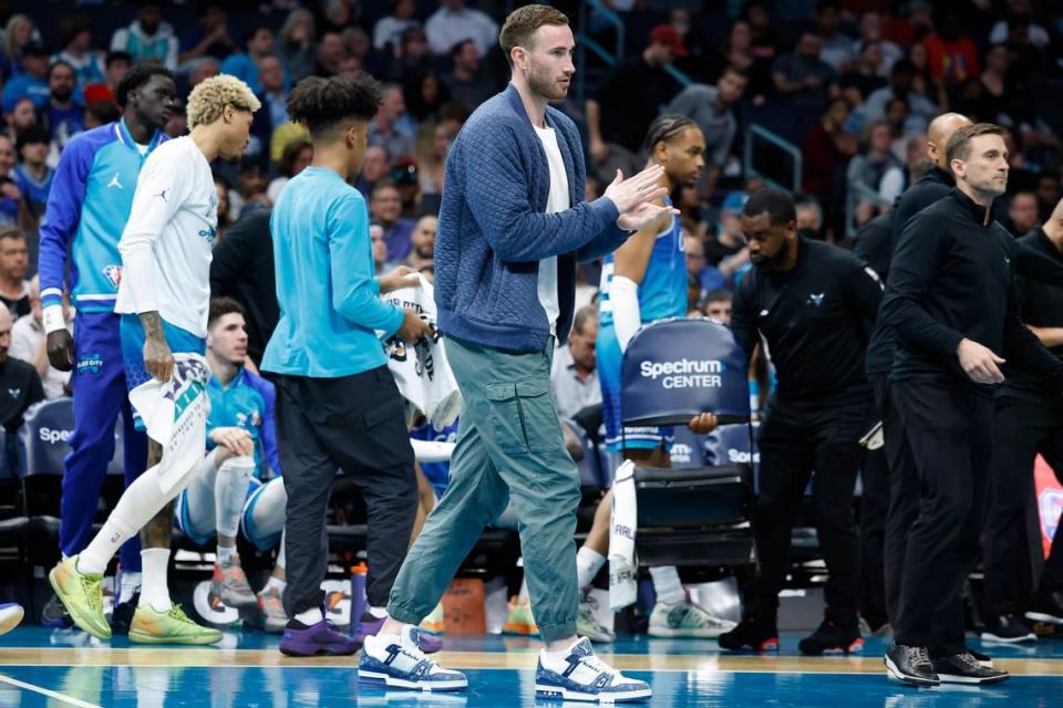 Charlotte Hornets forward Gordon Hayward (20) takes the court during a time out during a game against the Dallas Mavericks at Spectrum Center in Charlotte, N.C., Saturday, March 19, 2022.