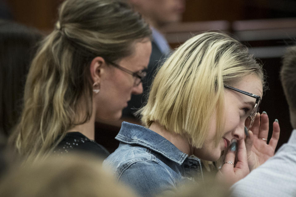 Cassidy Stay wipes her eyes as she listens during closing arguments in Ronald Haskell's capital murder, Wednesday, Sept. 25, 2019, in Houston. Haskell is on trial for the 2014 shooting of six members of his ex-wife's family in suburban Houston. Stay is the only survivor of the massacre. (Brett Coomer/Houston Chronicle via AP)