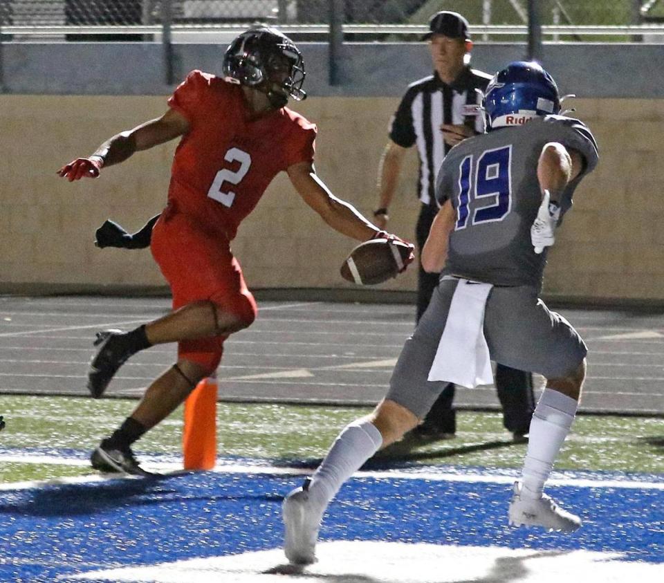 Trinity quarterback Ollie Gordon (2) steps across the goal line for the final score of the game in a District 3-6A high school football game at Kangaroo Stadium in Weatherford, Texas, Friday Oct. 22, 2021. Trinity defeated Weatherford 49-21. (Special to the Star-Telegram Bob Booth)