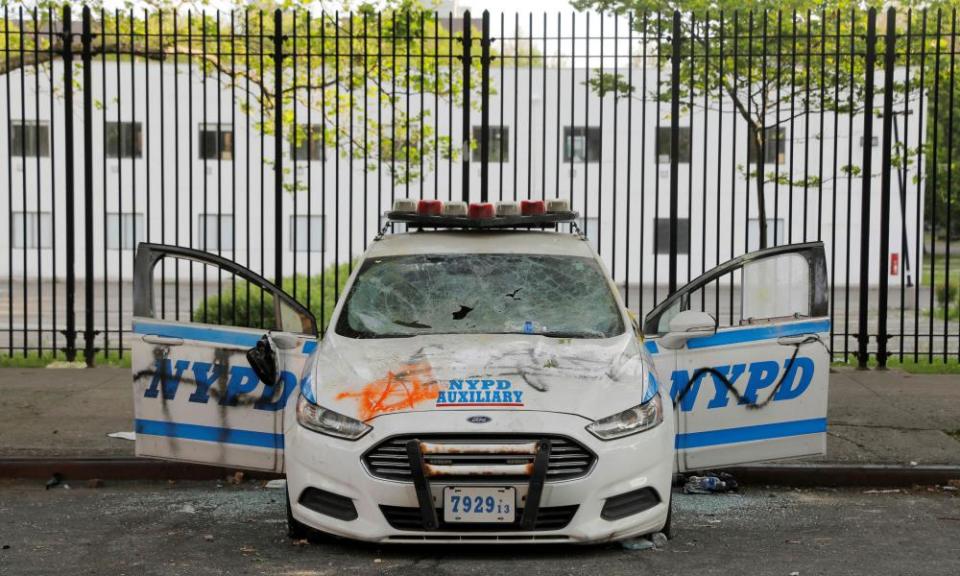 A vandalized New York police vehicle is seen the morning after a protest in Brooklyn on Saturday.