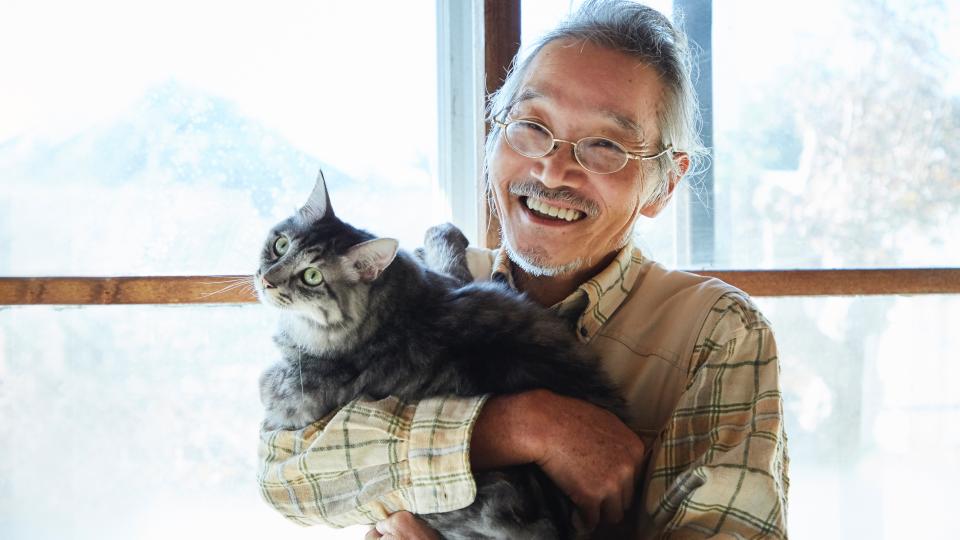 Japanese man holding his cat