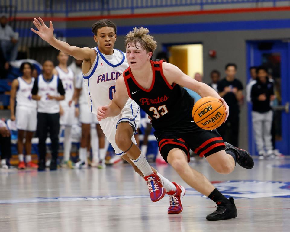 Dale's Dayton Forsythe (33) drives the ball against Millwood's Izaiah Wilson (0) during a high school basketball game, Tuesday, Jan. 23, 2024, at Millwood High School in Oklahoma City.