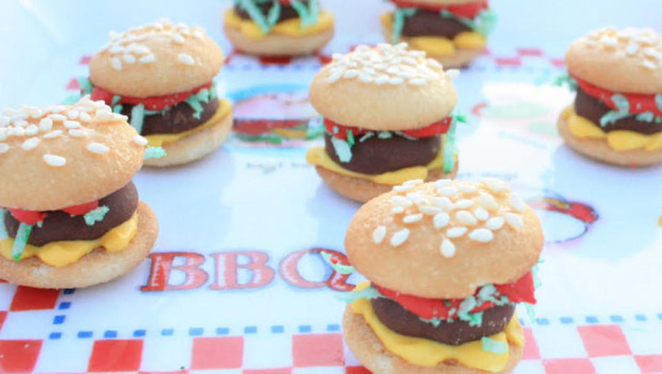 <p>Sue Sparks</p><p>Build some adorable one-bite burgers with vanilla wafers, shredded coconut and a couple drizzles of tinted icing. These Burger Bites come to us from Sue Sparks.</p><p><strong>Get the Recipe: <a href="/26741/suesparks/mini-dessert-hamburger-cookies/" data-ylk="slk:Mini Dessert Hamburger Cookies;elm:context_link;itc:0;sec:content-canvas" class="link ">Mini Dessert Hamburger Cookies</a></strong></p>