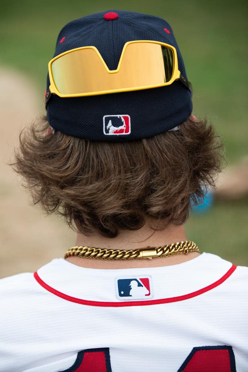 Nolan Sliver's glasses reflect while he watches a game between the Y-D Red Sox and Orleans.