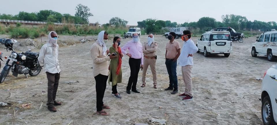 Local authorities, including the sub-divisional magistrate, on the ghats on the morning of 13 May inspecting the site.