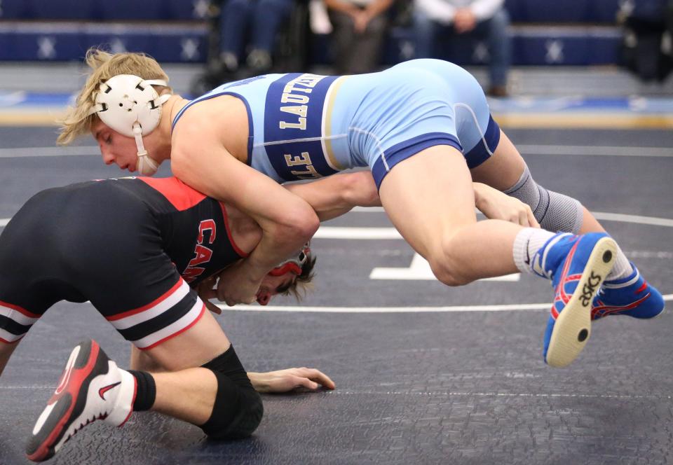 Garett Lautzenheiser (right) of Louisville defeated Logan Miller of Canfield in a 126 pound bout during their match at Louisville on Thursday, Feb. 4, 2021. 