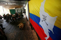 <p>Members of the 51st Front of the Revolutionary Armed Forces of Colombia (FARC) listen to a lecture on the peace process between the Colombian government and their force at a camp in Cordillera Oriental, Colombia, August 16, 2016. (John Vizcaino/Reuters) </p>