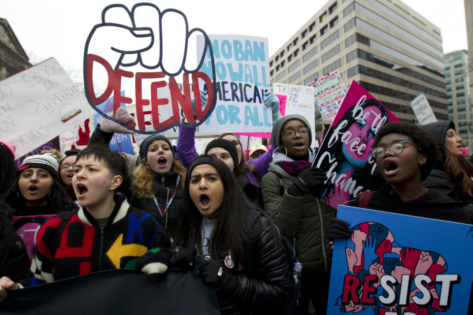 Demonstrators hold up their banners as they march on Pennsylvania Av., during the Women’s March in Washington on Saturday, Jan. 19, 2019. (Photo: Jose Luis Magana/AP)