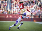 Minnesota Vikings free safety Xavier Woods (23) stops San Francisco 49ers wide receiver Brandon Aiyuk (11) who was trying to hurdle him in the second quarter of an NFL football game Sunday, Nov. 28, 2021, in Santa Clara, Calif. (Elizabeth Flores/Star Tribune via AP)